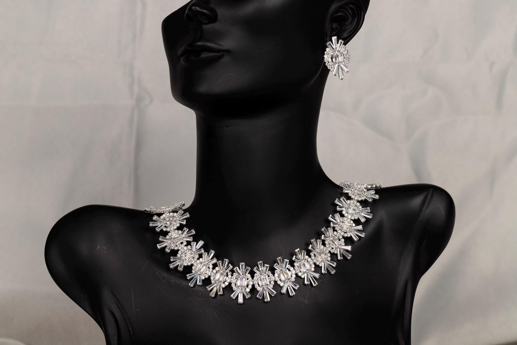 Silver crystal bridal necklace displayed on a black mannequin bust