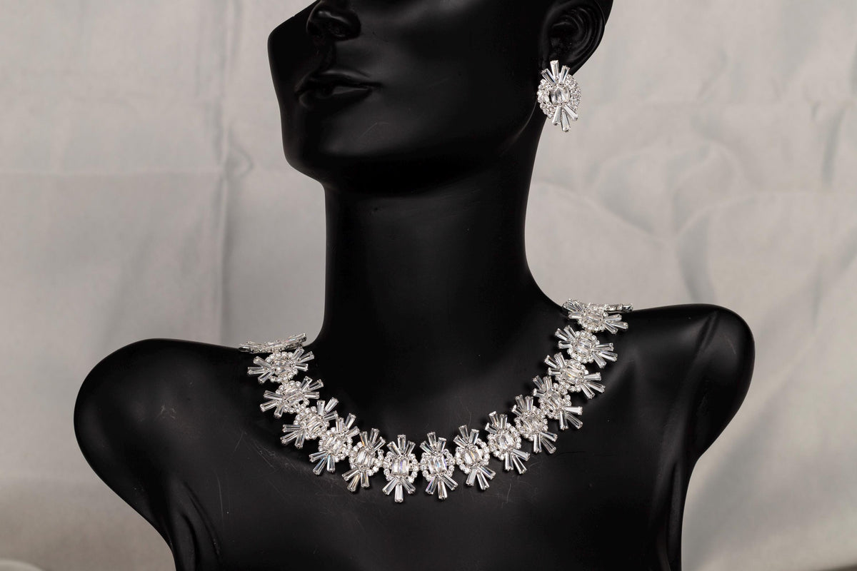 Silver crystal bridal necklace displayed on a black mannequin bust