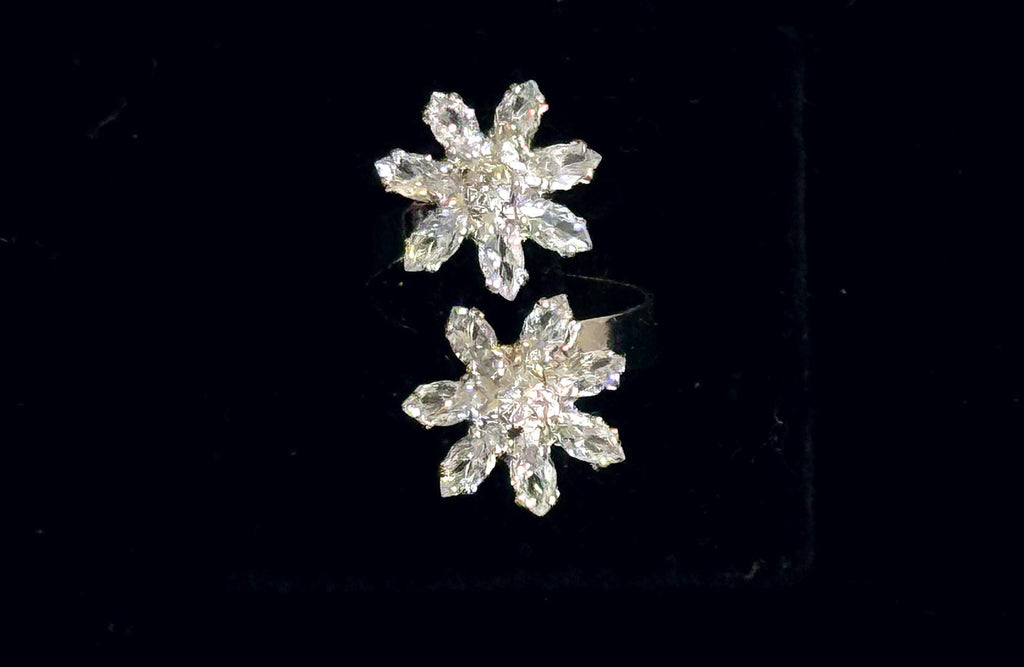 Adjustable silver floral crystal ring featuring a sparkling flower-shaped design