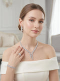 Bride wearing a baguette zircon jewelry set with a silver-tone double drop necklace, matching earrings, bracelet and ring.