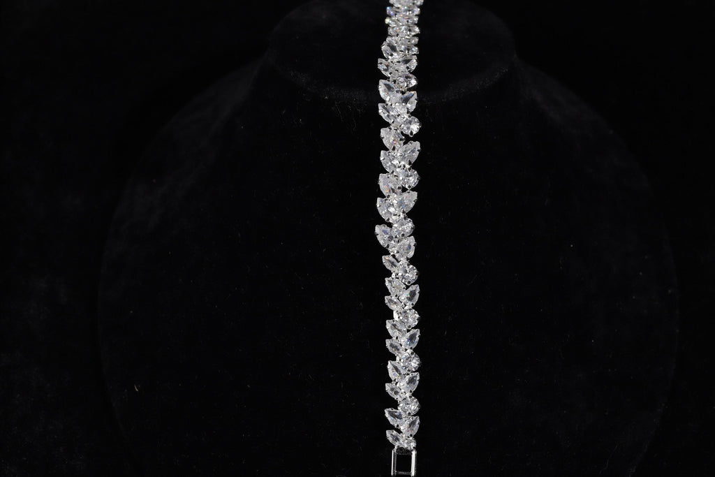 Close-up of the silver marquise crystal bracelet displayed vertically on black velvet.