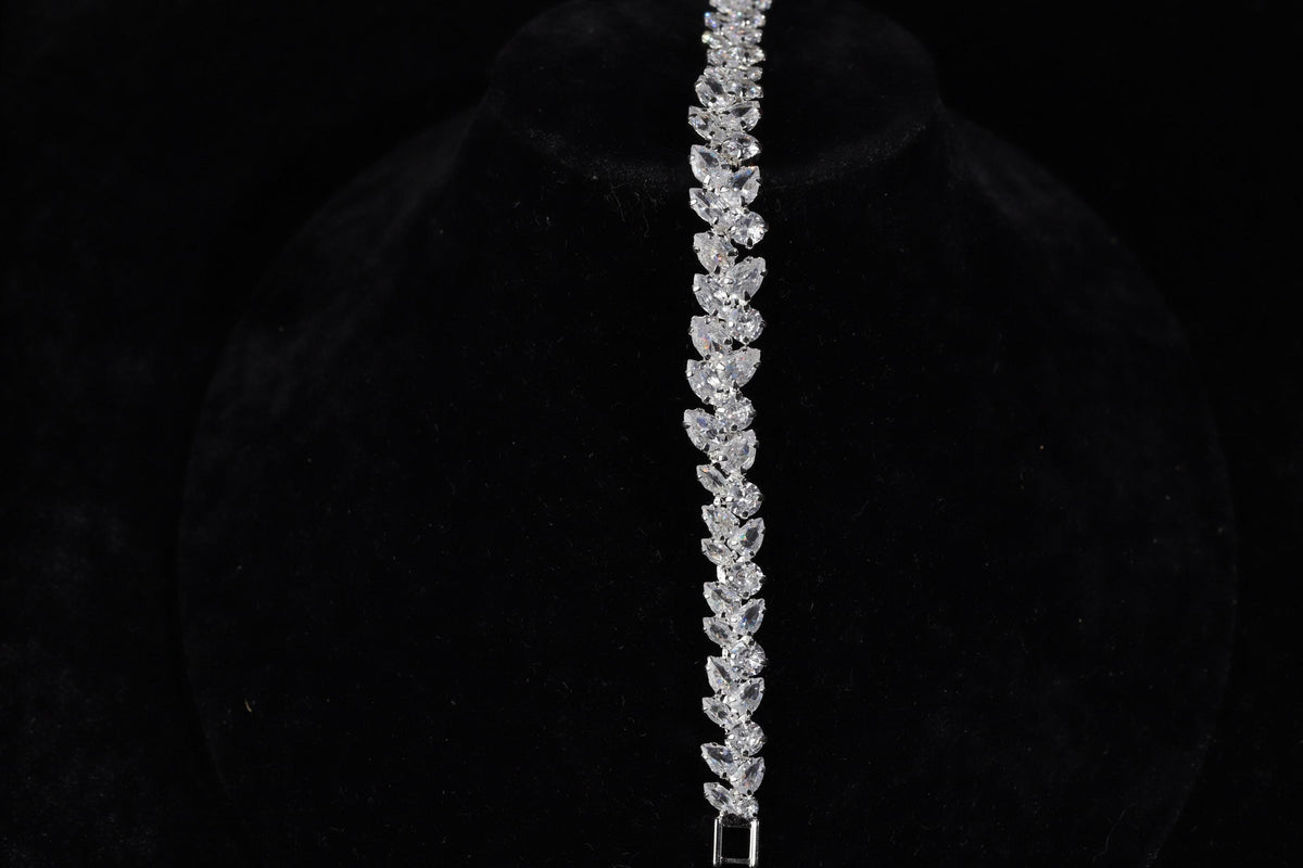 Close-up of the silver marquise crystal bracelet displayed vertically on black velvet.