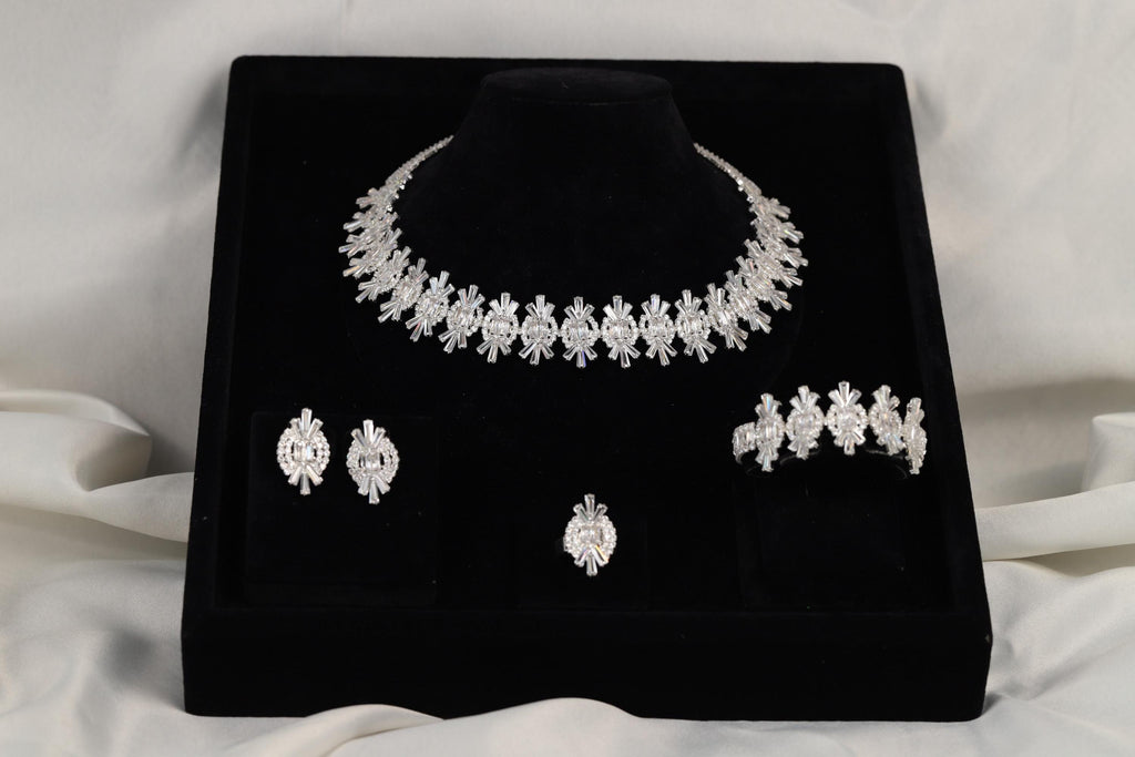 Four-piece silver crystal jewelry set presented in a black gift box