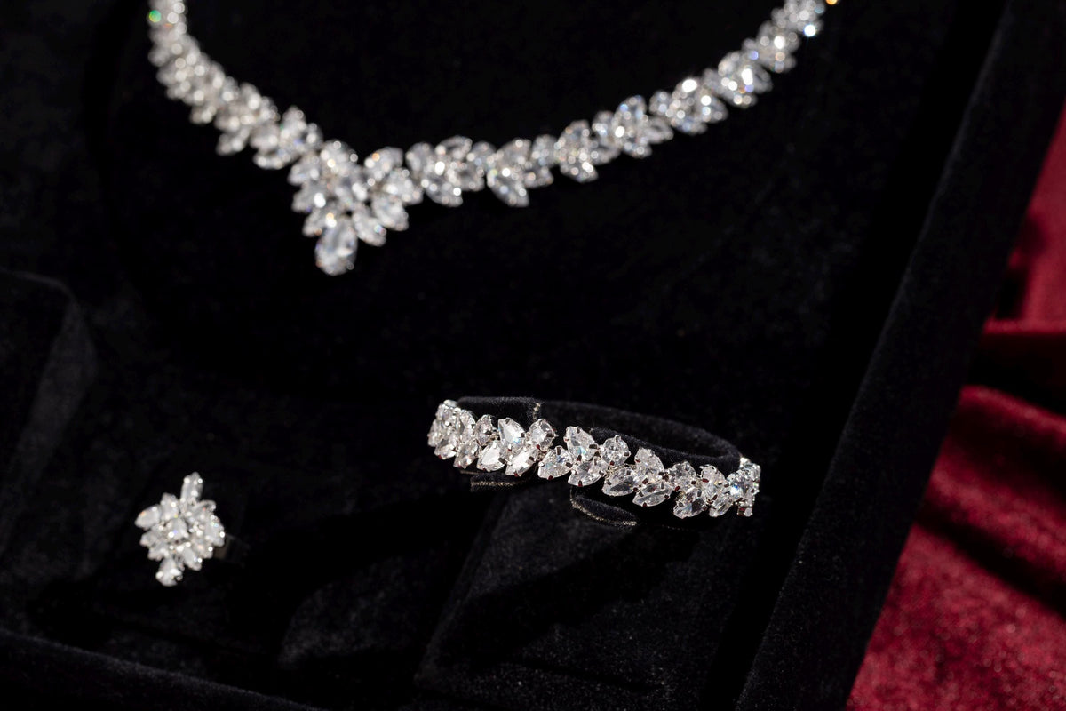 Close-up of the silver marquise crystal necklace centerpiece, bracelet and adjustable ring on black velvet.