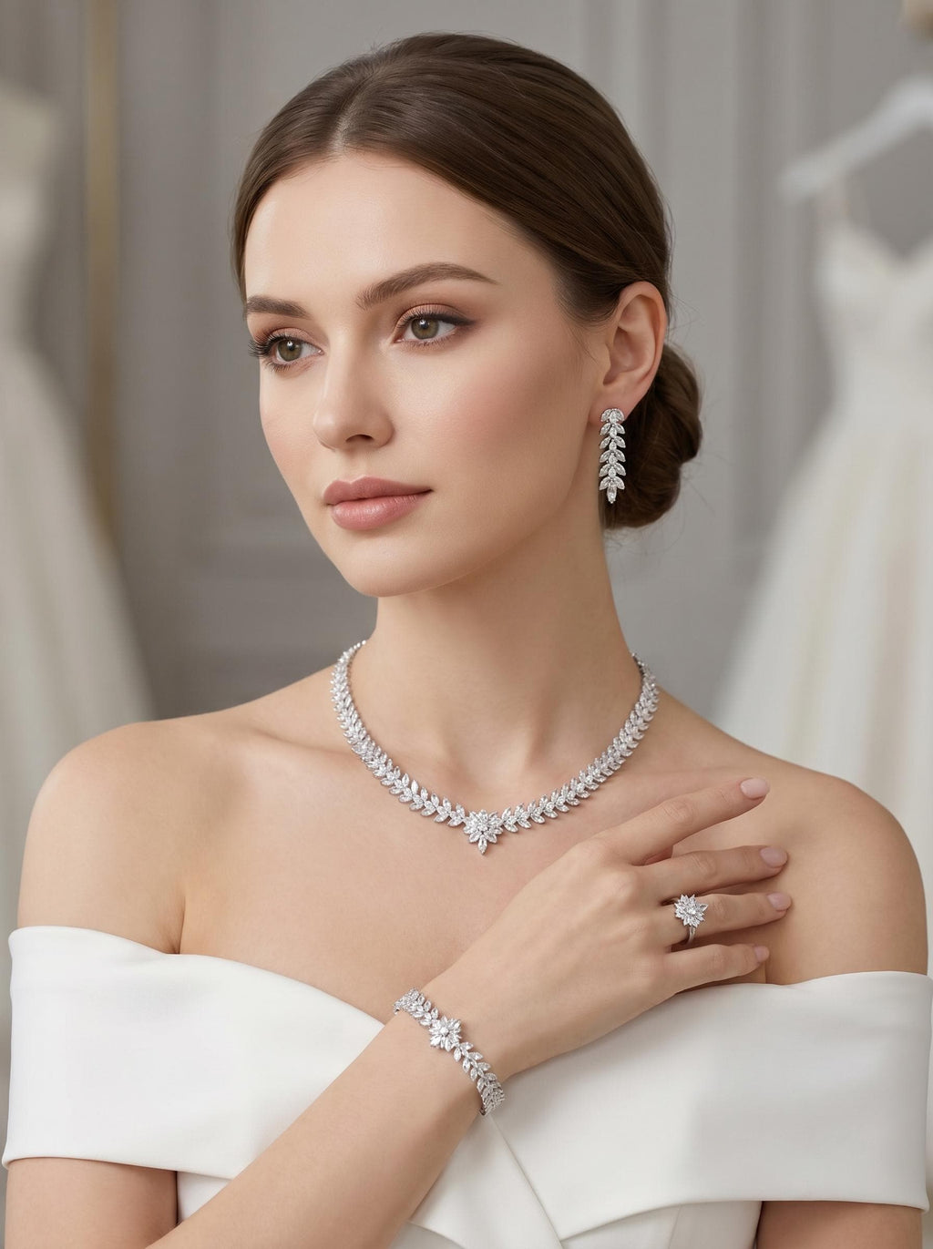 Model wearing a leaf and flower bridal jewelry set with a zircon necklace, drop earrings, bracelet and floral ring.