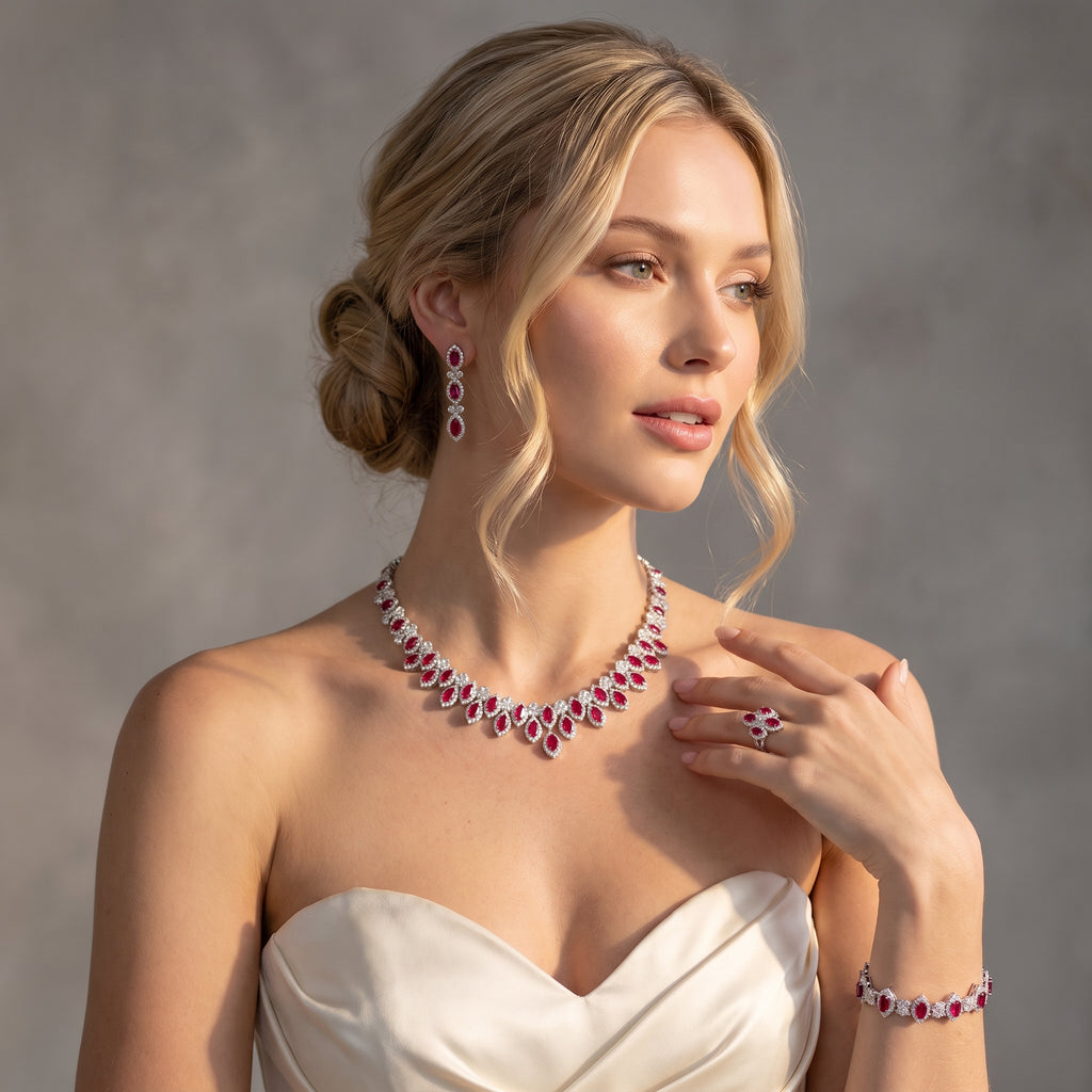 Model wearing a red zircon jewelry set with a silver-tone halo necklace, drop earrings, matching bracelet and statement ring.