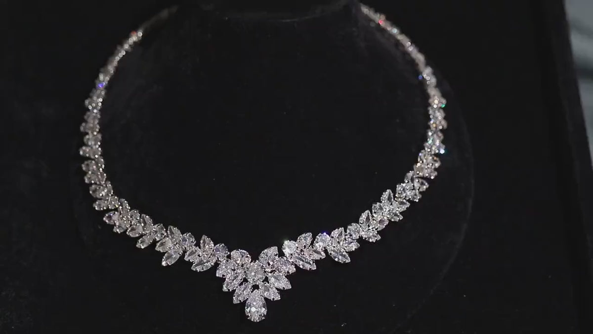 Close-up video of the silver marquise crystal necklace sparkling on a black velvet display.